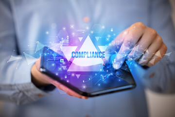 Businessman holding a foldable smartphone, business concept