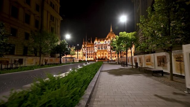 Budapest, Hungary, August 2022. Amazing night pov walking towards the parliament. The night lighting enhances the beauty and elegance of the building.