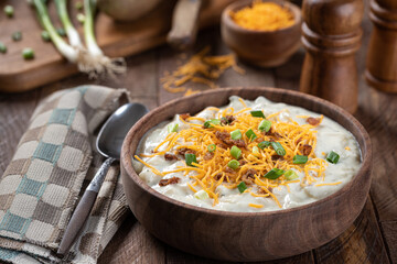 Cream of potato soup with bacon, cheese and green onions
