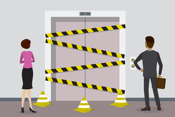 Elevator not working, business people standing in front of closed lift doors and warning tapes. Employees can not get to desired floor, elevator is under repair. Movement problems. © naum