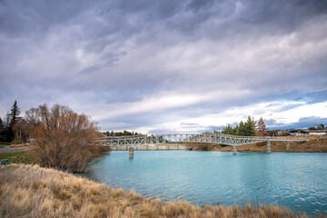 The Lake Tekapo foot bridge, over the Scott pond, connecting the Church of the Good Shepherd to Lake Tekapo town.