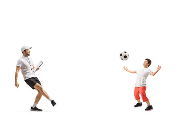 Fototapeta na wymiar Football coach praticing with a boy