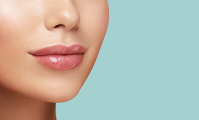 Close up photo of women lips. Cosmetology beauty injetion procedure. Hyaluronic acid. Lip protection balm. Hygienic lipstick - obrazy, fototapety, plakaty