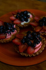 close up of mixed berry tarts