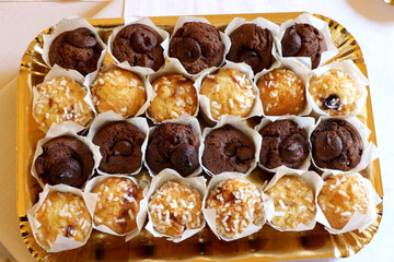 Tray with mini chocolate and vanilla muffins
