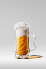 Mug of beer. Creative artwork with glass of light beer made from yellow and white cloth imitating real beer drink. Ideas, imagination, art, Oktoberfest, taste