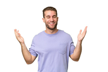 Young handsome caucasian man isolated on green chroma background smiling a lot