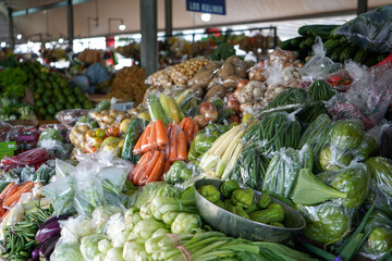 Many eggplants, tomatoes, potatoes, carrots, cucumbers, chilies, red chilies, corn, onions, avocados, chayote, green beans, long beans, garlic are sold in Bandungan Market, Semarang,  Indonesia.