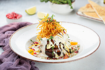 FRIED EGGPLANT served in dish isolated on table top view of arabian food