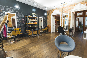 Stylish beautician and hairstylist salon. No people. Full length indoor shot. Copy space. High...