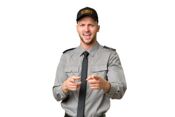 Young security caucasian man over isolated background pointing to the front and smiling