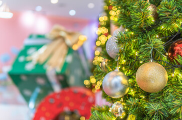 Christmas ball on tree with bokeh light blurred backgrounds and free space for text celebrations Merry Christmas, Happy New Year 