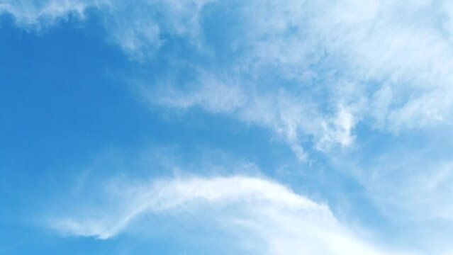Time lapse white fluffy and beautiful cumulus clouds motion smoothly freedom  tranform many shapes on blue sky  in daytime beauty in  nature top view tropical cloudscape 