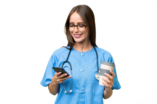 Young nurse caucasian woman over isolated background holding coffee to take away and a mobile