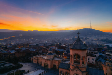 Aerial skyline with downtown district and Bell tower gate at sunset, Tbilisi, Georgia