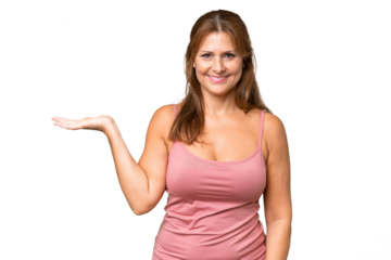 Middle-aged caucasian woman over isolated background holding copyspace imaginary on the palm to insert an ad