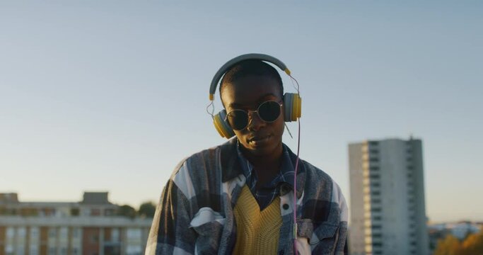 Young Black Woman Dancing on a Roof in Urban Area