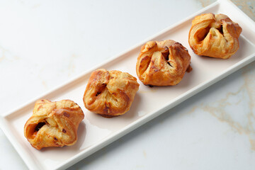 Banquet table with variety of stuffed pies pastry