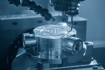 The 5-axis CNC milling machine  hole cutting on the metal  part.