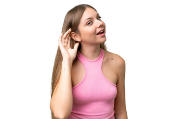 Young beautiful blonde woman over isolated background listening to something by putting hand on the ear