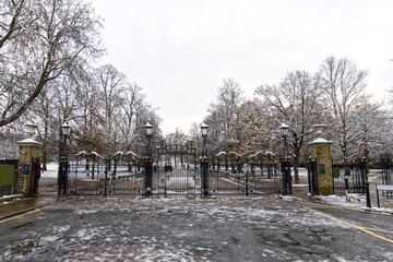 Greenwich Park gate in London in Great Britain in Winter covered by snow