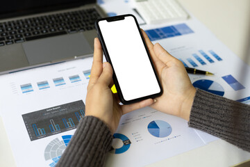 Business woman holding a smartphone with copy space.