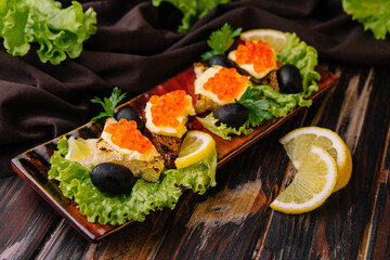 Bread and butter with a red caviar