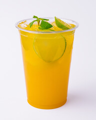Alcohol cocktails with orange juice and lime slices