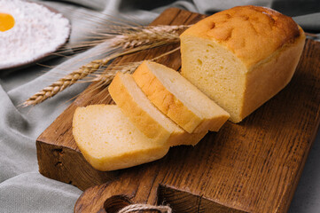 Fresh bread on wooden board closeup
