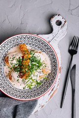 Cepelins or zeppelins with pork and pancetta cracklings © AntAlexStudio