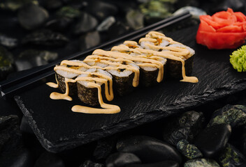 Japanese rolls in a restaurant with fish and vegetables