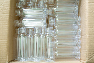 Plastic bottle,The PET bottles in the rail on the conveyor belt for filling process in the drinking...