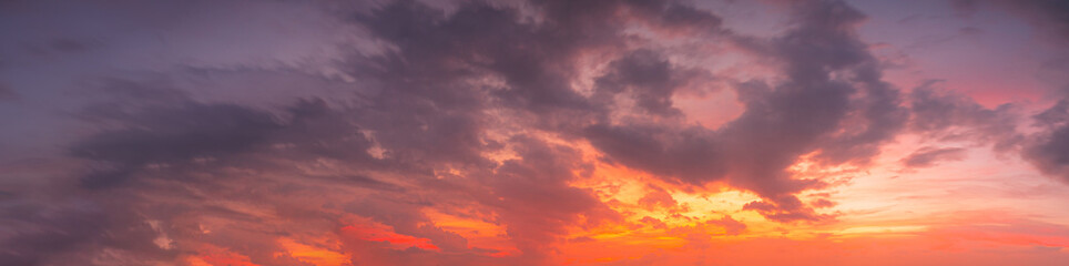clouds and orange sky,Real amazing panoramic sunrise or sunset sky with gentle colorful clouds. Long panorama, 