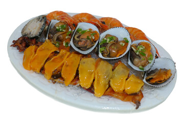 A plate of fresh seafood such as clams and sea squirts is provided.