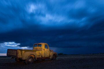 1951 International Harvester pickup truck at a farm under storm clouds in Bennet, Nebraska, USA; Bennet Nebraska United States of America