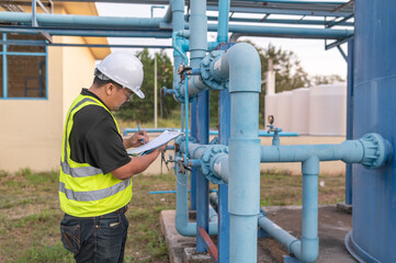 Environmental engineers work at wastewater treatment plants,Male plumber technician working at water supply