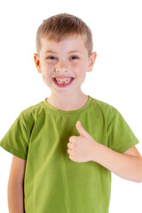 Portrait of smiling boy showing thumbs up gesture.