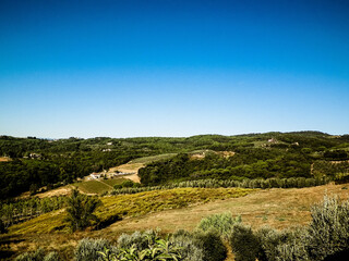 Fototapeta na wymiar Hills, fields and meadows - typical views of Tuscany, Italy.