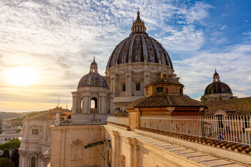 Fototapeta na wymiar St. Peter's basilica dome in Vatican aat sunset