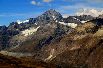 Fototapeta premium Landscape with mountain ranges with snow on the tops on a Mount Gornergrat, near Zermatt, in southern Switzerland 