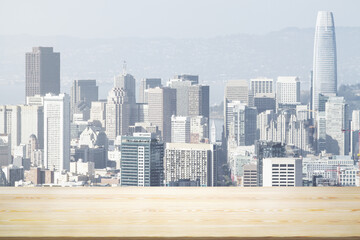 Empty wooden table top with beautiful San Francisco skyscrapers at daytime on background, mock up