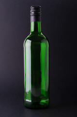 Wine bottle close up  on a black background