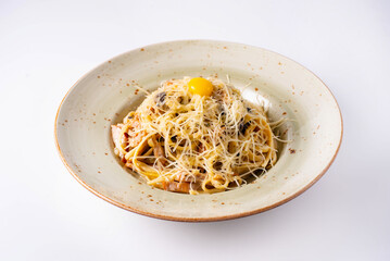 pasta with cheese and yolk on a white background