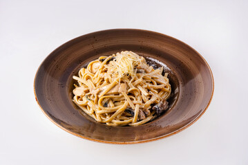 macaroni with mushrooms and cheese on a white background