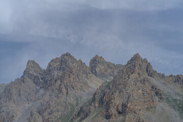 Fototapeta premium Rocky mountain peaks in Maira Valley mountains, Italian Cottian Alps