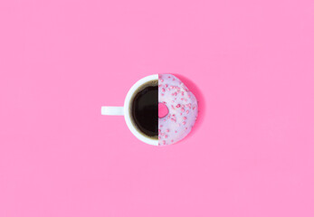 Collage of donut with pink glaze and coffee cup on the pink background. Top view. Copy space.