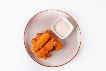 cheese sticks with sauce on a white background