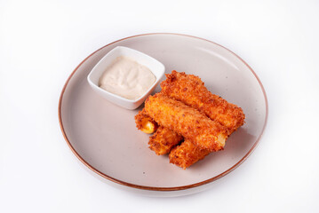 cheese sticks with sauce on a white background