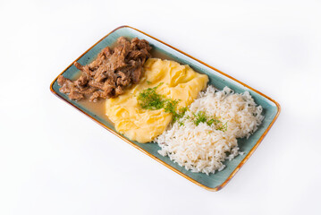 stewed meat with mashed potatoes and rice, served in a restaurant, on a white background