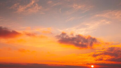 Sunlight Shining Through Clouds. 4k Morning Sunrise Timelapse. Dramatic Sky. Sunny Cloudscape. Saturated Colors Of Clouds. Sunrise Sky Natural Background. Time Lapse Time-lapse. From Night To Dawn.